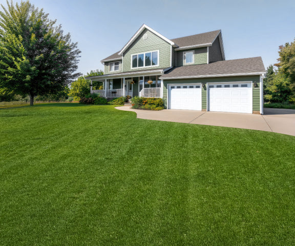 Navimow i110E robot lawn mower on a beautiful green lawn.