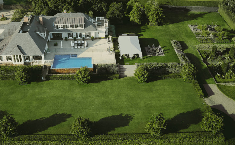 Navimow i110N robot lawn mower maintains this large green lawn.