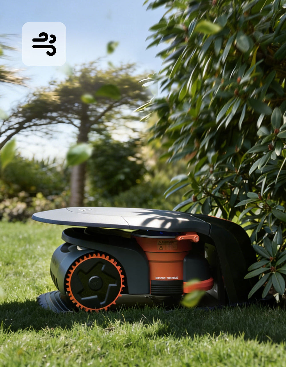The Navimow i110N robot lawn mower parked in a garden.