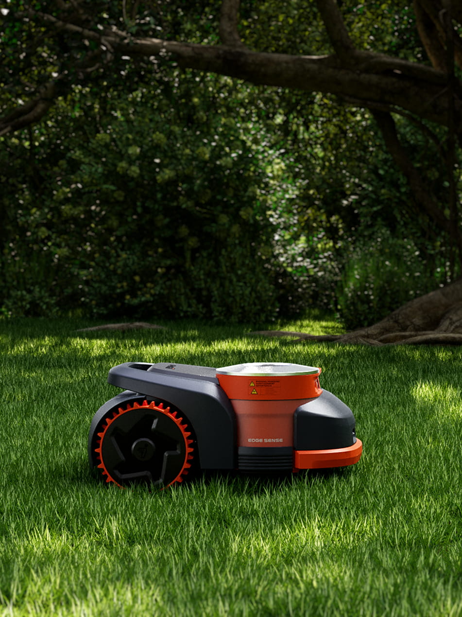 Navimow i105E robot lawn mower sitting on bright green grass.