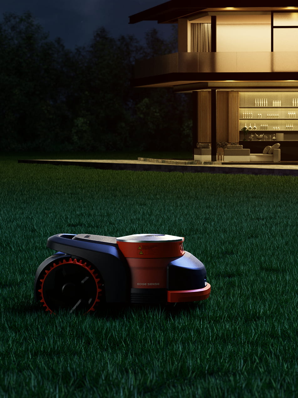 Navimow i110N robot lawn mower working on grass at night.