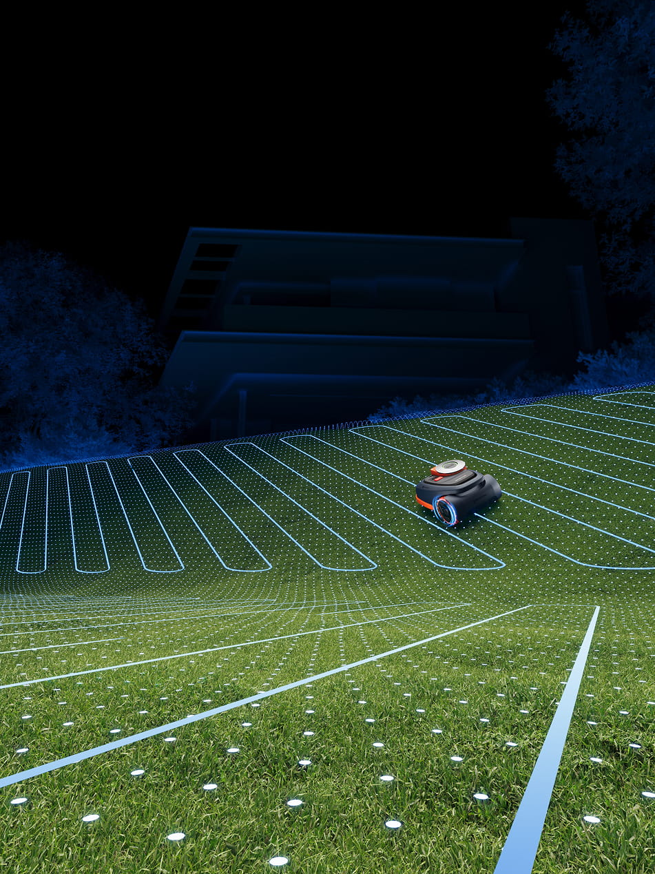 Segway Navimow i110N robot lawn mower mows grass at night.