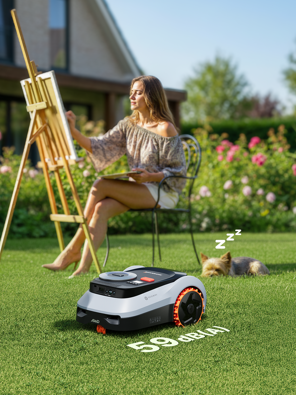 Navimow i110N robot lawn mower mows while a dog sleeps.