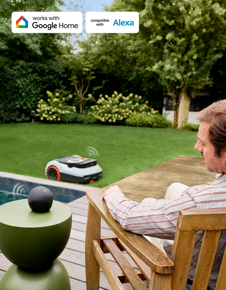 Navimow i105E robot lawn mower mows the lawn while owner relaxes.