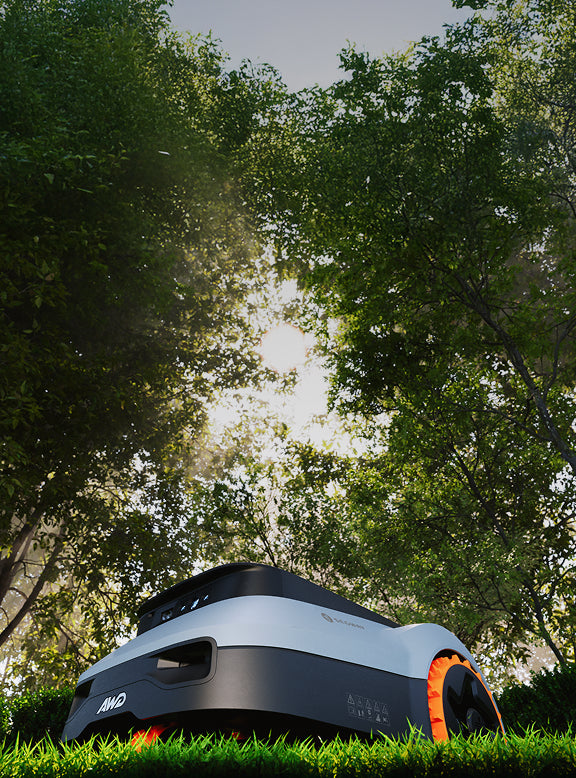 Segway Navimow i110 AWD robot lawn mower mows the grass.