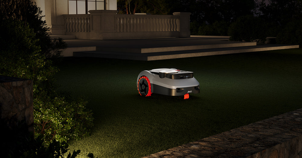 Navimow i110N robot lawn mower mows the green grass tonight.